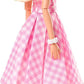 Barbie The Movie Doll Wearing Pink and White Gingham Dress with Daisy Chain Necklace for Ages 3 Years and Up