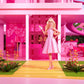 Barbie The Movie Doll Wearing Pink and White Gingham Dress with Daisy Chain Necklace for Ages 3 Years and Up