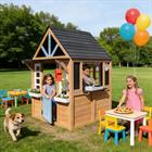 Kids Outdoor Playhouse, Wooden Outside Playhouse, Kids Playhouse for Backyard Garden with Play Kitchen, Chalkboard, Windows, Flower Pot, Birdcage, Bench & Pet Door